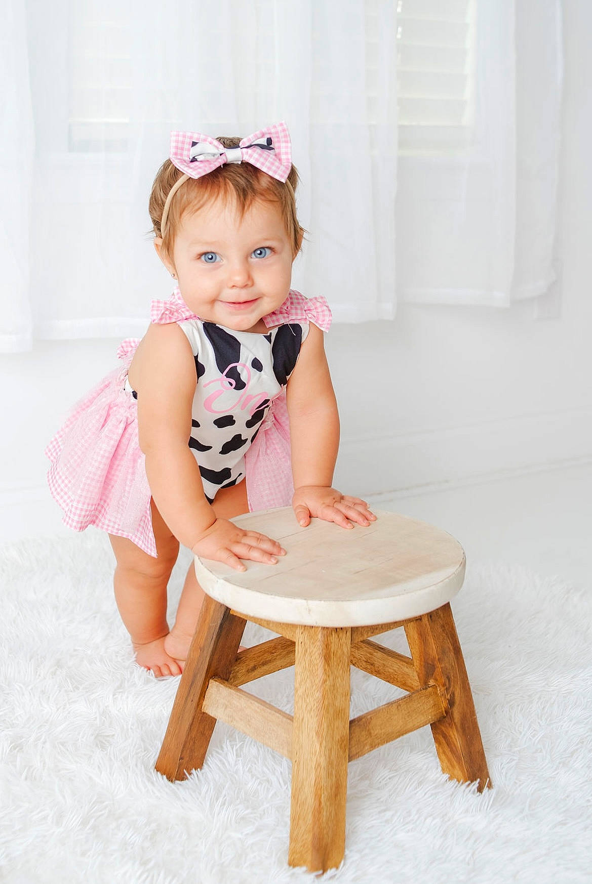 Madalynn is registered to the contest to win money with this photo: arm, baby, baby_toddler_clothing, comfort, dress, happy, hat, human_leg, joy, knee, leg, magenta, pattern, peach, person, pink, sitting, skin, sleeve, smile