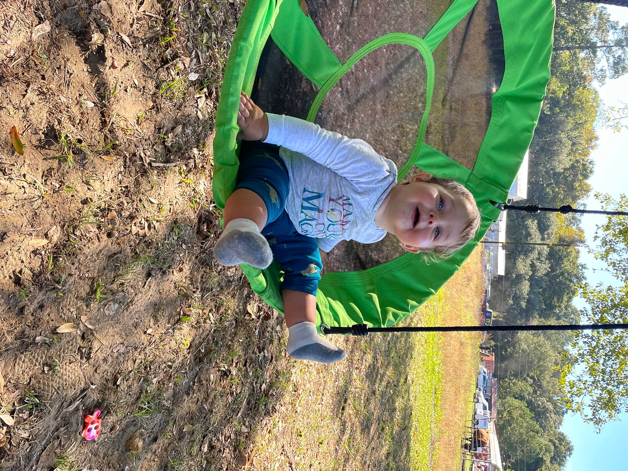 Madalynn is registered to the contest to win money with this photo: adaptation, adventure, child, city, electric_blue, fun, grass, happy, leisure, outdoor_play_equipment, people_in_nature, person, play, playground, recreation, sky, soil, swing, t_shirt, toddler