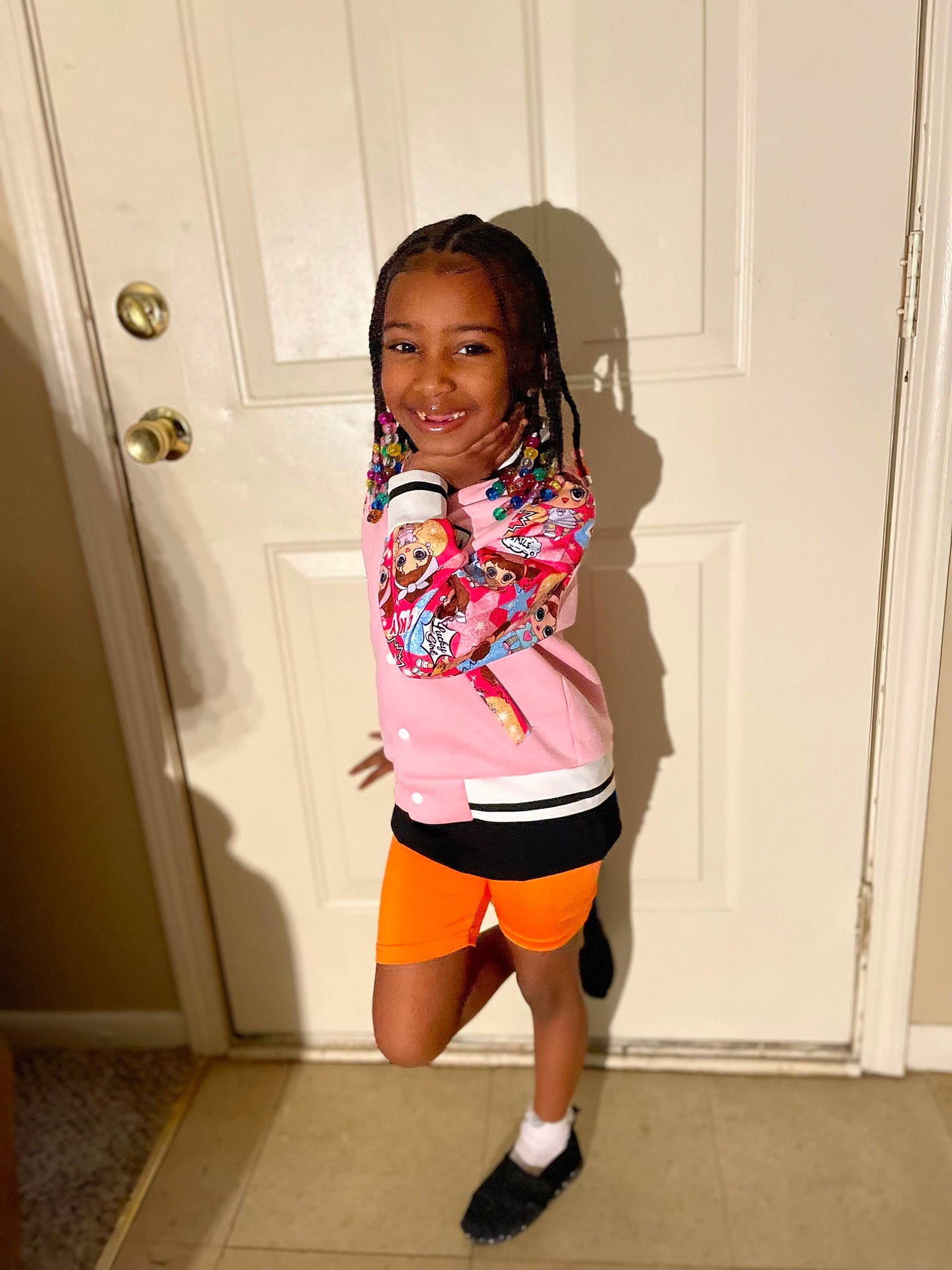 Alayshia is registered to the contest to win money with this photo: abdomen, black_hair, door, happy, human_leg, joint, joy, knee, leg, long_hair, magenta, person, shorts, shoulder, sleeve, smile, t_shirt, textile, thigh, toddler