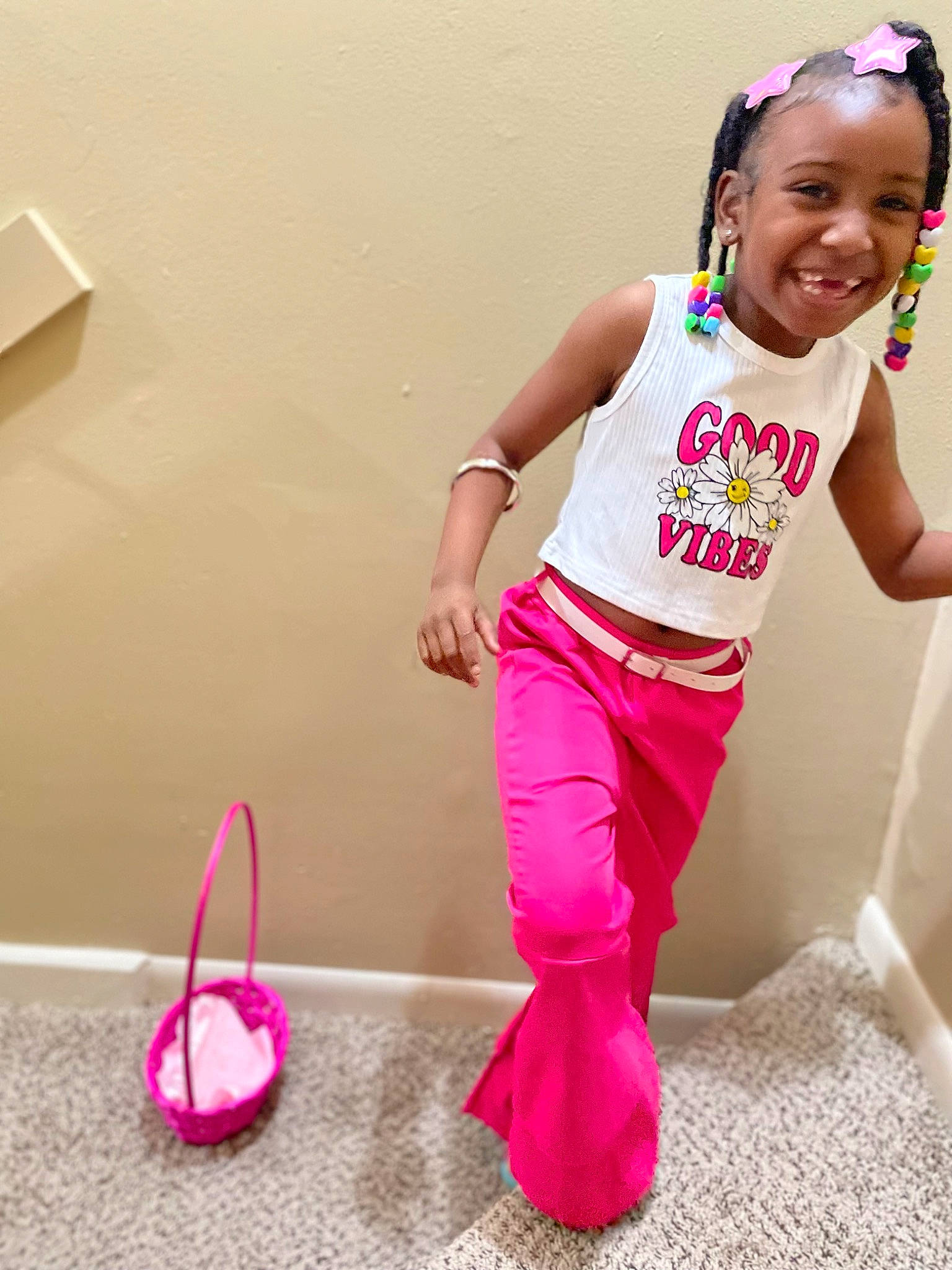 Alayshia is registered to the contest to win money with this photo: active_tank, baby_toddler_clothing, child, flooring, fun, happy, joy, magenta, person, pink, play, purple, shoulder, sleeve, sleeveless_shirt, smile, sportswear, sweatpant, t_shirt, thigh