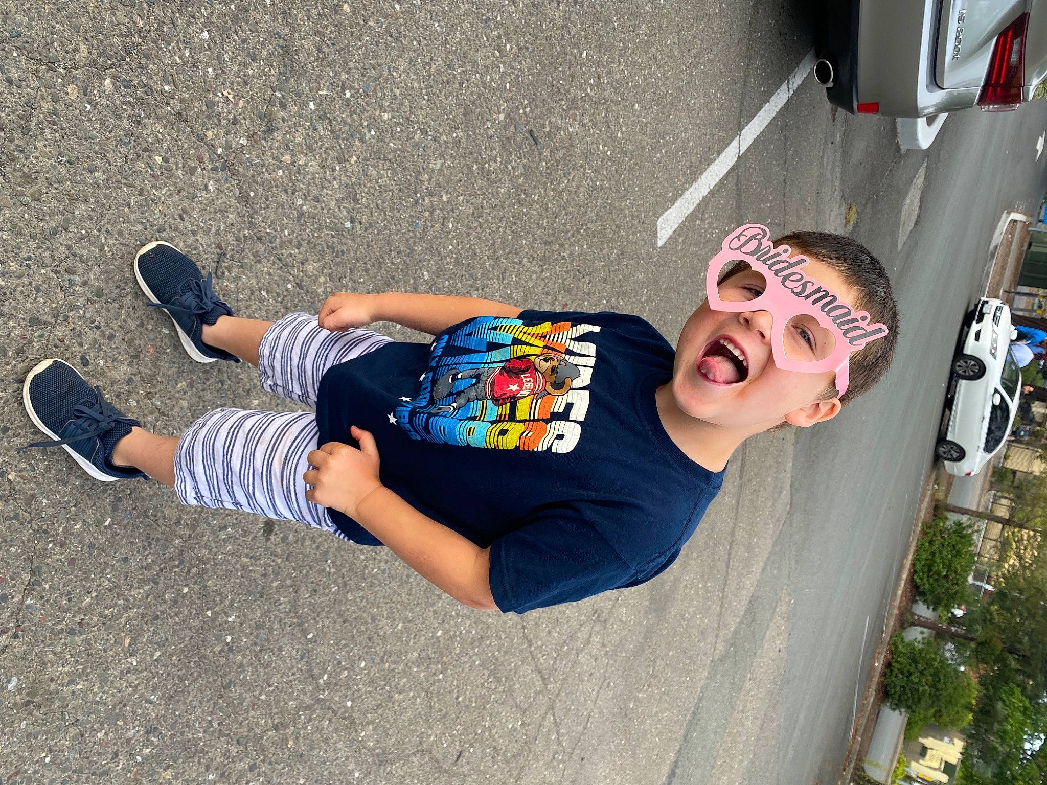 John joined the competition — help win amazing prizes! asphalt, automotive_tire, car, cool, eyewear, fun, hairstyle, human_leg, leisure, people, person, road_surface, sidewalk, smile, street_fashion, t_shirt, tire, vehicle_door, walking_shoe, wall