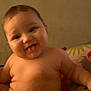 Everleigh joined the competition — help win amazing prizes! baby, child, tongue_out, smiling, chubby, cute, infant, sitting, pillow, colorful, indoor, happy, playful, skin, face, head, arm, torso, person, young