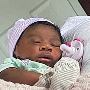 Chaunsea Harris is registered to the contest to win money with this photo: baby, blanket, child, closeup, cozy, cute, glove, hat, indoor, infant, newborn, pacifier, peaceful, person, portrait, resting, sleep, sleeping, soft, tender