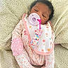 Chaunsea Harris is registered to the contest to win money with this photo: baby, blanket, child, closeup, comfort, cute, face, floral_pattern, indoors, infant, mitten, newborn, onesie, pacifier, peaceful, pink, resting, sleeping, soft, white