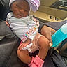 baby, bottle, bow, car_interior, clothing, colorful, cute, door, hand, hat, infant, newborn, pacifier, peaceful, person, pink_socks, resting, seat, sleeping, window