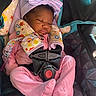 baby, bow_hat, car_seat, child, cozy, cute, floral_pattern, harness, indoors, infant, newborn, pajamas, peaceful, pink_clothing, portrait, resting, seatbelt, sleeping, small_person, toddler