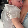 Theo is registered to the contest to win money with this photo: baby, sleeping, child, person, closeup, indoor, holding, comfort, skin, clothing, denim, zipper, face, ear, arm, human, tenderness, love, caring, portrait