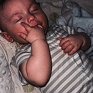 Theo joined the competition — help win amazing prizes! baby, sleeping, hand, blanket, striped_clothing, infant, bed, pajamas, peaceful, cozy, soft_texture, child, cute, resting, indoors, portrait, young_child, sleep, comfort, relaxation
