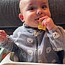 Theo joined the competition — help win amazing prizes! baby, child, high_chair, snack, eating, crumbs, grey_jacket, bear_pattern, cute, indoor, tousled_hair, happy, hands, face, food, cozy, infant, portrait, table, messy