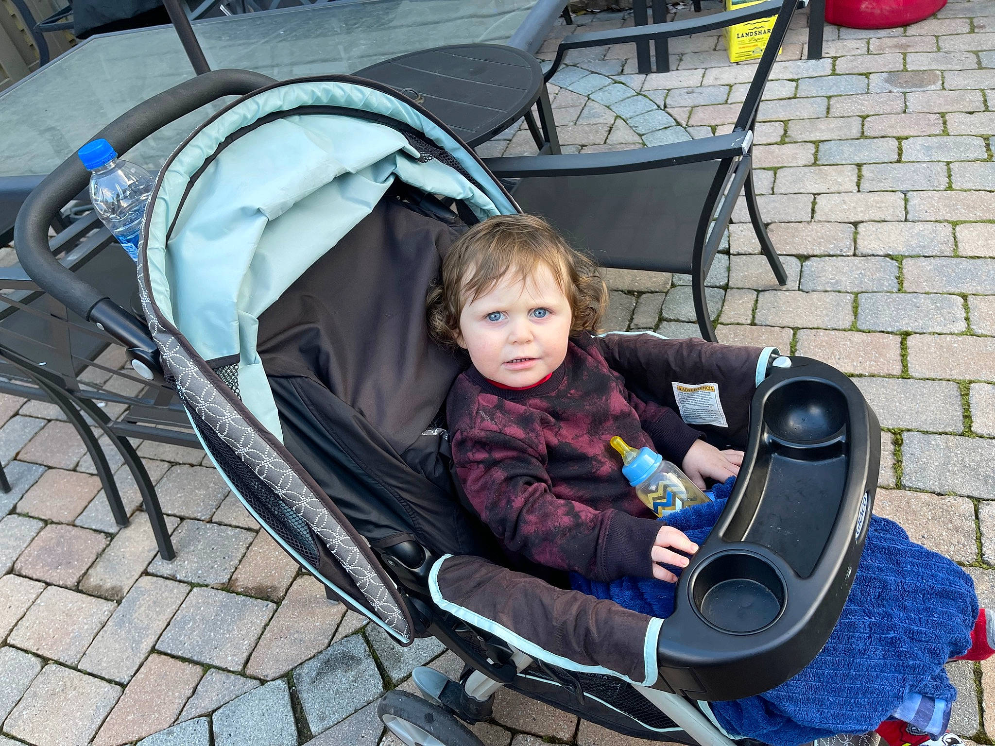 Nolan is registered to the contest to win money with this photo: auto_part, automotive_design, automotive_exterior, baby_carriage, baby_products, chair, child, comfort, eye, fun, leisure, mode_of_transport, motor_vehicle, outdoor_furniture, person, product, recreation, sitting, snapshot, toddler