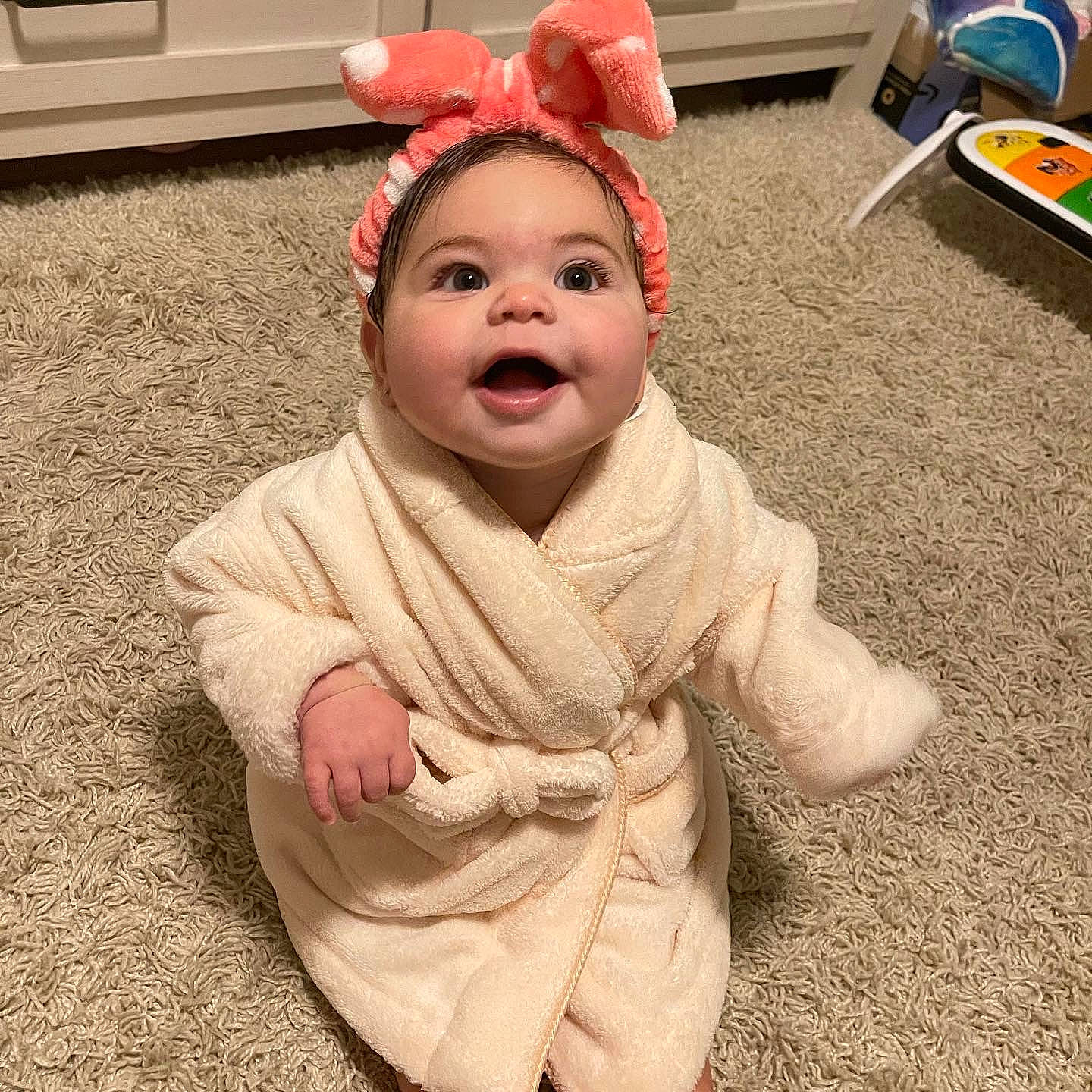 Ella joined the competition — help win amazing prizes! baby, baby_toddler_clothing, cap, child, costume_hat, eye, fictional_character, floor, flooring, gesture, happy, head, headgear, human_body, nose, person, plant, selfie, sleeve, smile