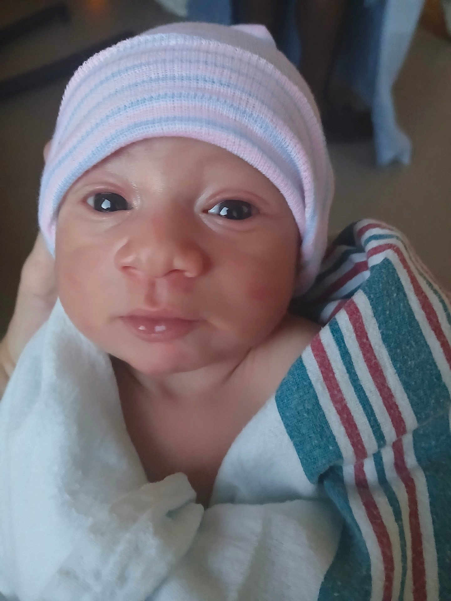 Jeremiah joined the competition — help win amazing prizes! newborn, baby, infant, face, hat, blanket, wrapped, hospital, closeup, portrait, cute, young, skin, eyes, person, newborn_baby, headwear, soft_lighting, indoor, human