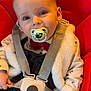 baby, infant, pacifier, car_seat, safety_harness, buckle, bow_tie, fur_jacket, onesie, hand, smile, cheeks, eyes, portrait, close_up, red_seat, straps, cute, clothing, young_child