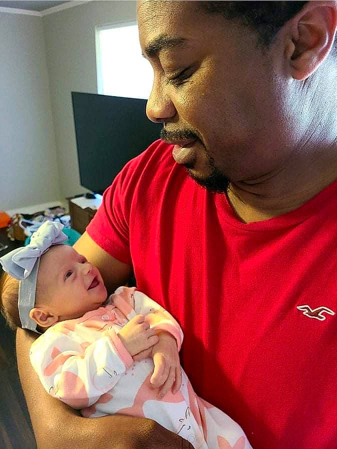 Mazikeen is registered to the contest to win money with this photo: abdomen, baby, beard, child, comfort, ear, elbow, event, facial_hair, finger, forehead, headwear, joint, mouth, muscle, nose, organ, person, room, skin