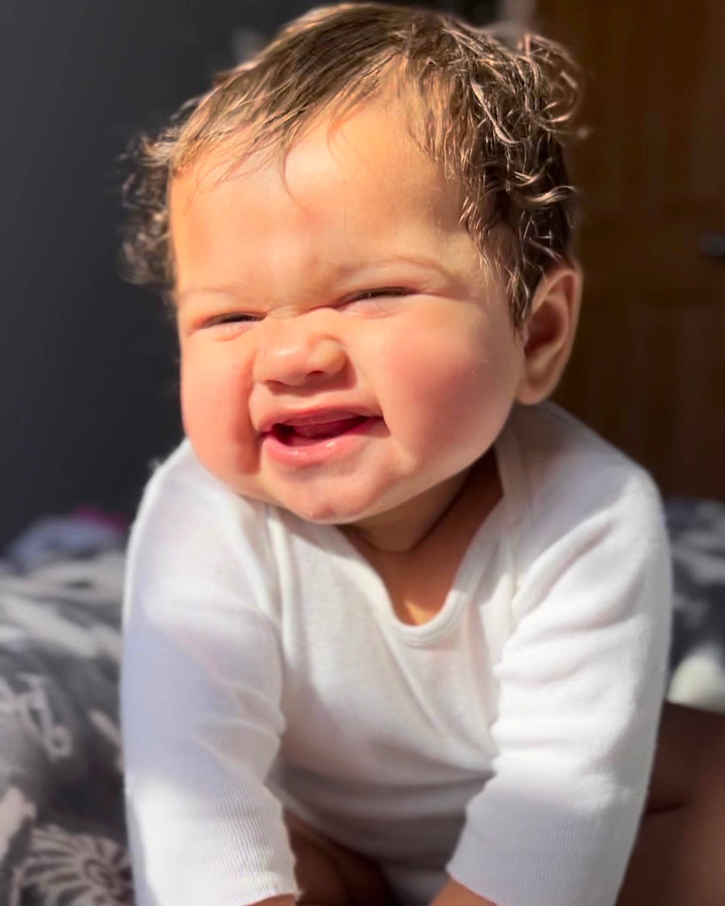 Gracen is registered to the contest to win money with this photo: baby, baby_toddler_clothing, cheek, comfort, ear, eyelash, flash_photography, fun, gesture, happy, human_body, iris, jaw, lip, mouth, nose, person, sleeve, thumb, toddler