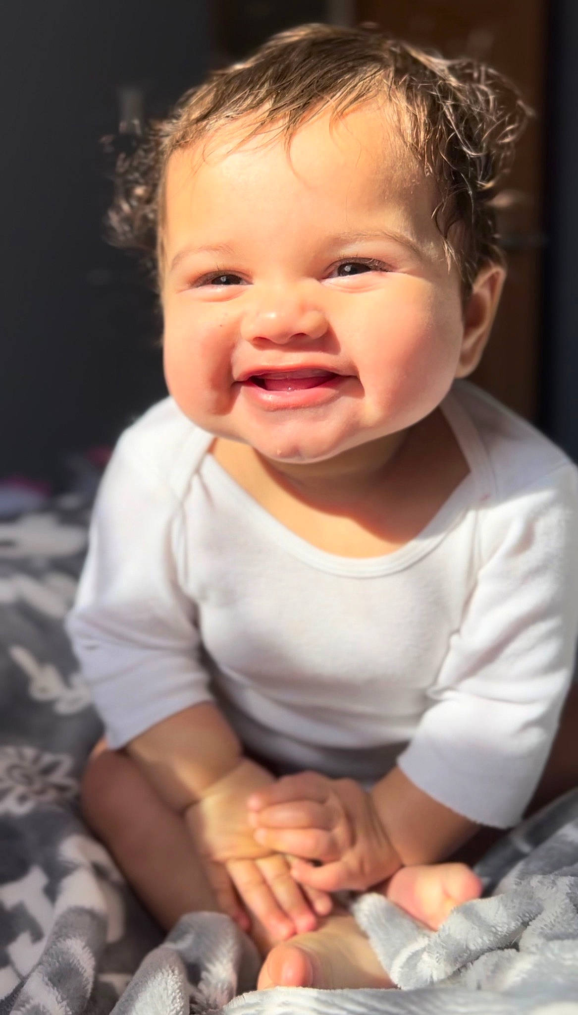 Gracen is registered to the contest to win money with this photo: arm, baby, baby_toddler_clothing, cheek, chin, comfort, eyelash, face, flash_photography, gesture, happy, iris, joy, lip, mouth, nose, person, skin, sleeve, smile