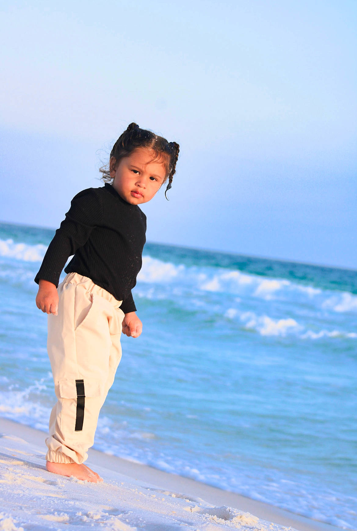 Nevaeh is registered to the contest to win money with this photo: barefoot, beach, child, coastal_and_oceanic_landforms, flash_photography, fun, gesture, happy, horizon, landscape, leisure, people_in_nature, people_on_beach, person, sand, shore, sky, travel, waist, water