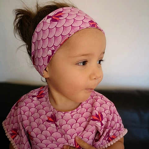 Ayana a rejoint le concours — aidez-le/la à gagner de superbes lots ! baby, beanie, bonnet, cap, cheek, child, clothing, crochet, fashion_accessory, hair_accessory, hat, head, headband, headgear, knit_cap, knitting, magenta, pattern, person, pink