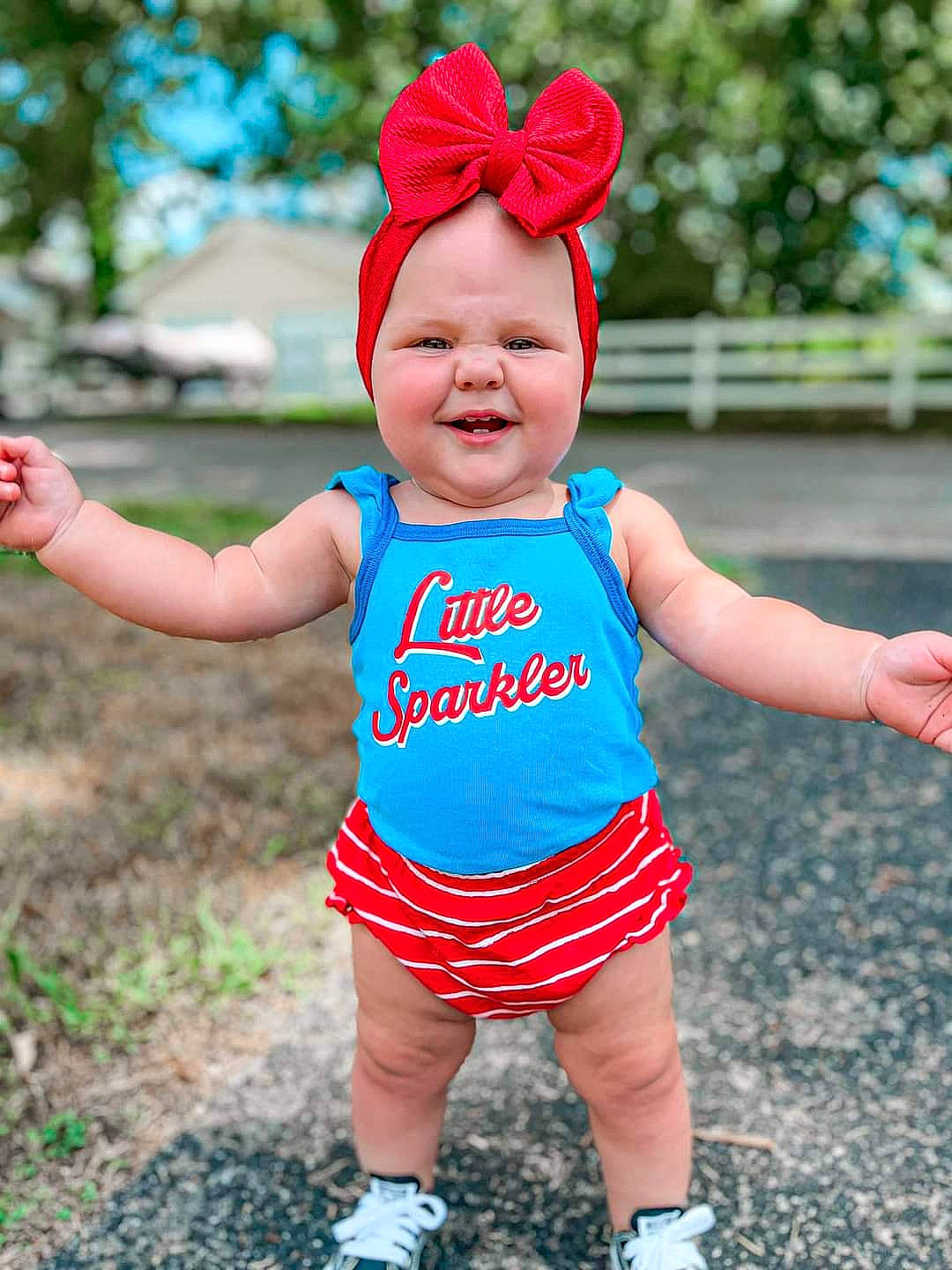 Millie is registered to the contest to win money with this photo: baby, baby_toddler_clothing, child, costume_hat, electric_blue, fun, grass, happy, hat, headgear, headwear, joy, magenta, people_in_nature, person, pink, recreation, red, sleeve, smile