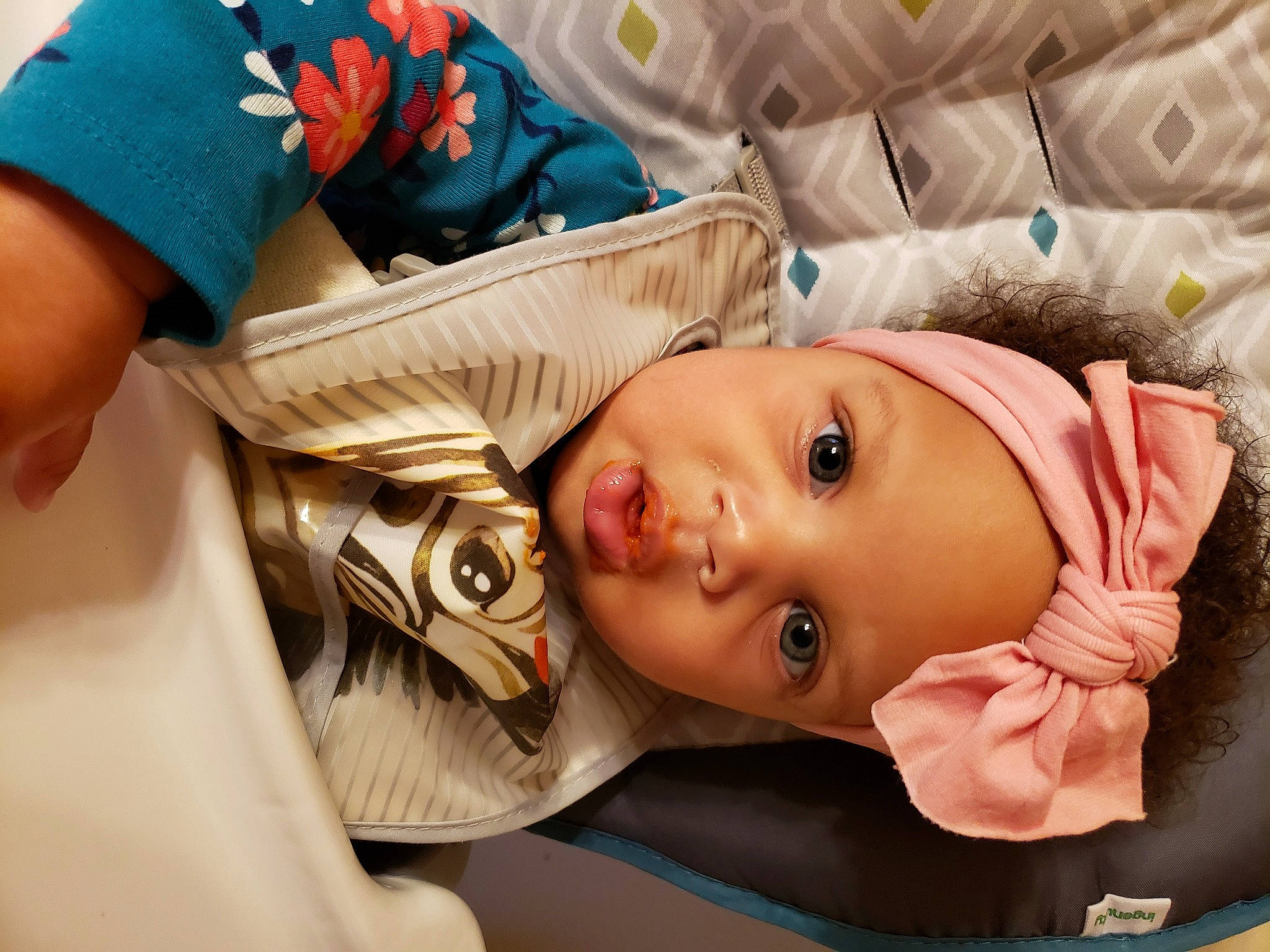 Tinsley is registered to the contest to win money with this photo: baby, baby_products, baby_toddler_clothing, cheek, child, comfort, eye, eyelash, fashion_accessory, gesture, happy, headwear, iris, linens, mouth, nose, person, room, skin, textile