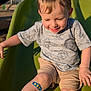 Silas is registered to the contest to win money with this photo: child, toddler, smile, slide, playground, bandage, shorts, shirt, mickey_mouse, sunlight, outdoor, happy, face, arm, leg, skin, toy, fun, play, casual