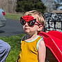child, boy, sunglasses, spiderman, yellow_shirt, outdoor, sunny, playground, slide, grass, toy, summer, casual_clothing, blond_hair, portrait, daylight, fun, cute, person, fashion