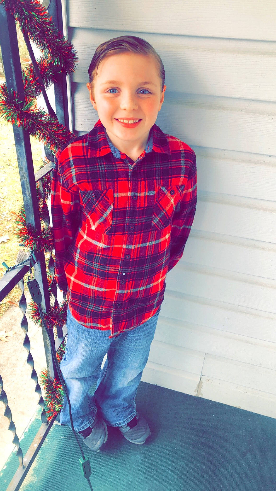 Rhylynn is registered to the contest to win money with this photo: child, child_model, denim, design, fun, holiday, jeans, joy, outerwear, pattern, person, photography, plaid, smile, standing, t_shirt, tartan, textile, toddler, tree
