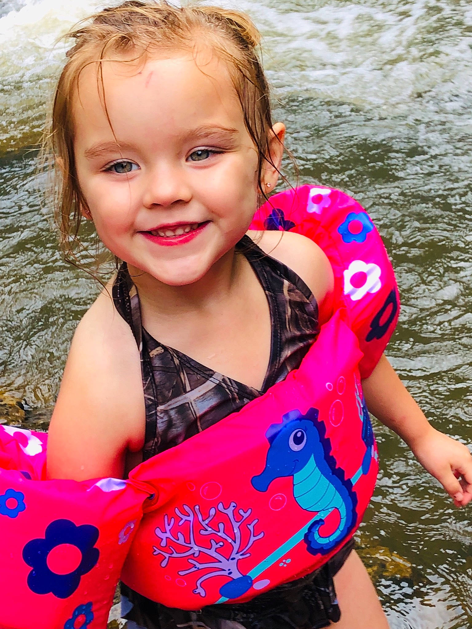 Khloe is registered to the contest to win money with this photo: baby_products, child, cool, fun, happy, joy, leisure, lifejacket, person, personal_protective_equipment, pink, play, product, recreation, smile, summer, toddler, vacation, water