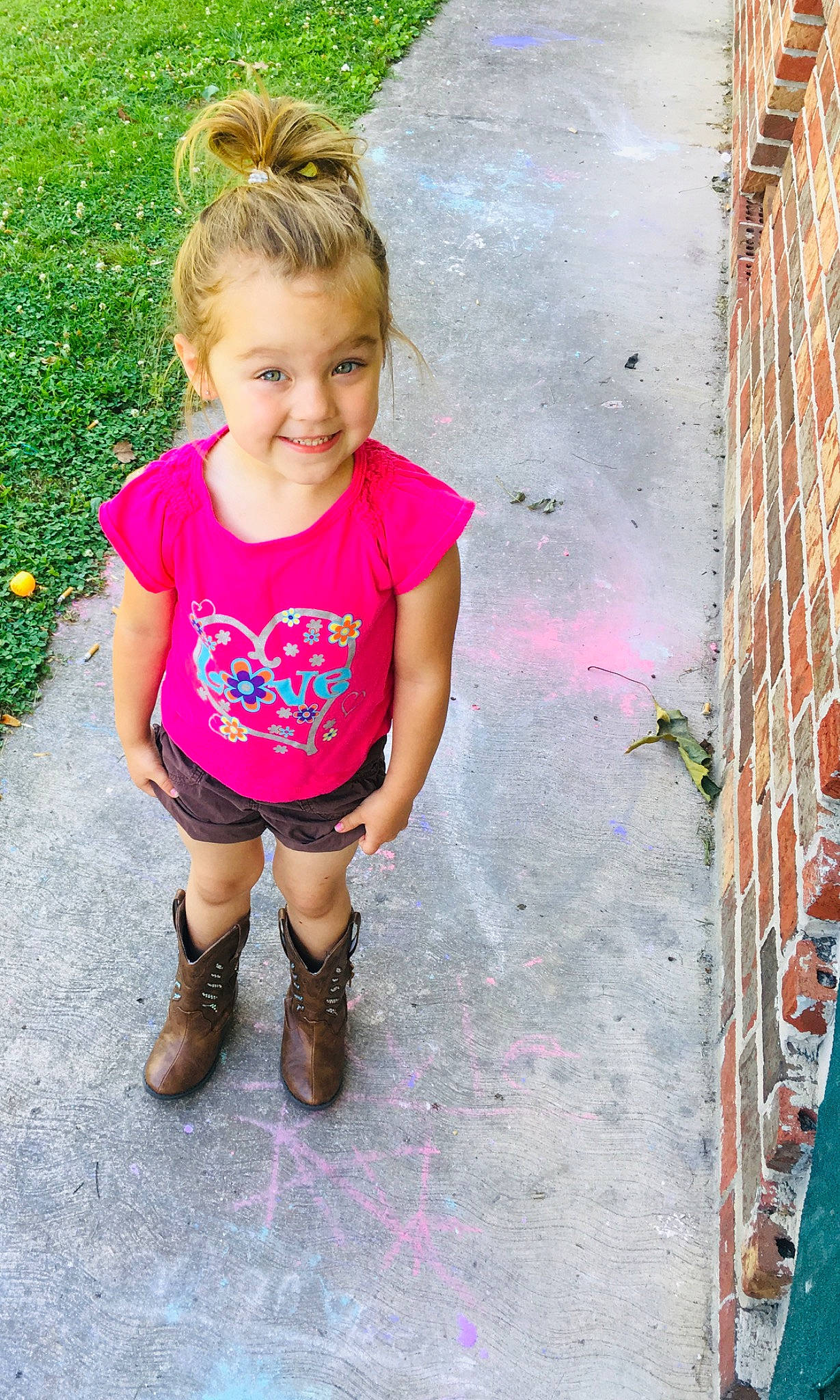 Khloe is registered to the contest to win money with this photo: baby_toddler_clothing, blond, child, child_model, dress, footwear, hairstyle, joy, leg, leggings, pattern, person, pink, plant, play, shoe, sleeve, smile, standing, t_shirt