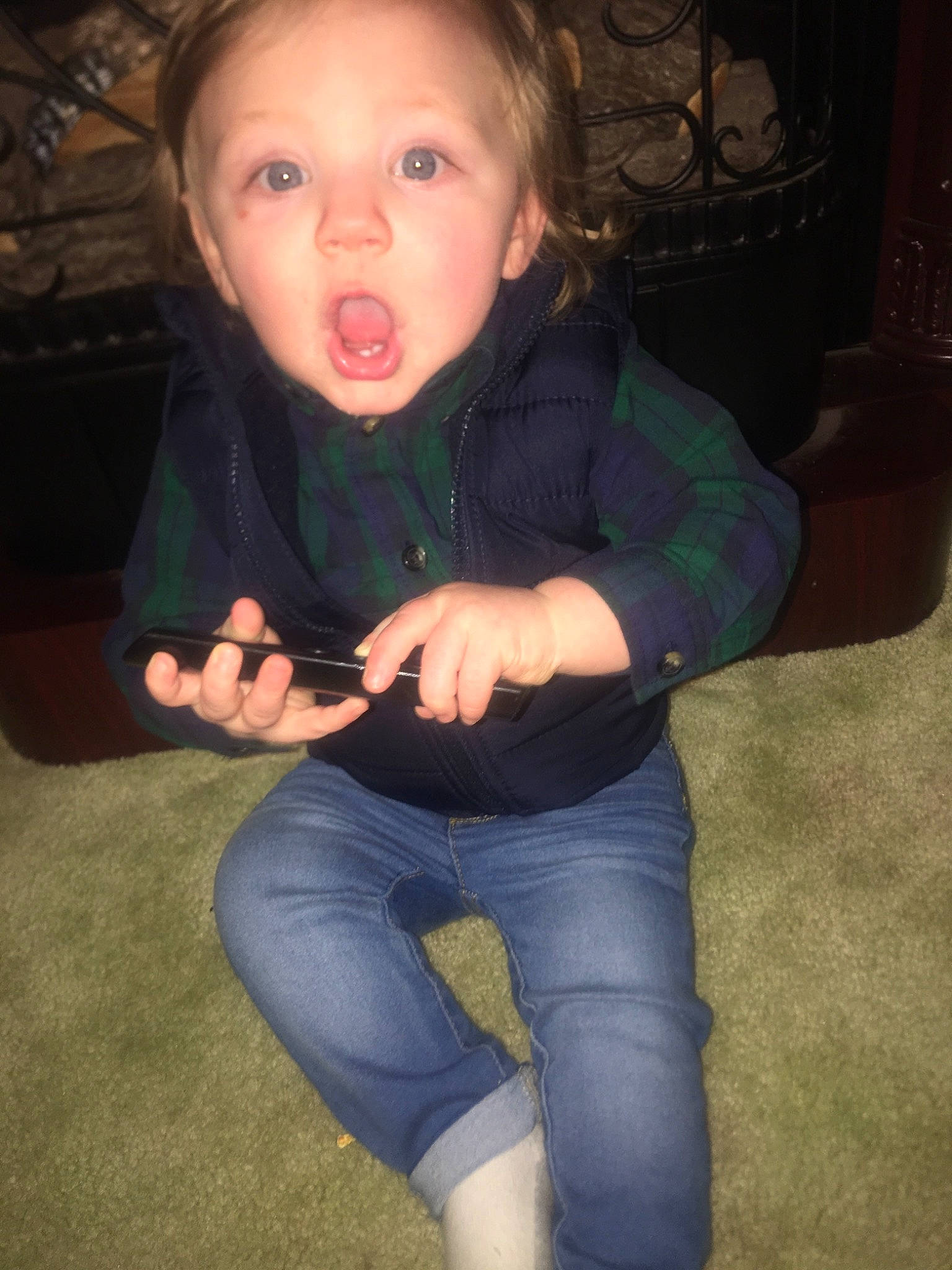 Levi is registered to the contest to win money with this photo: arm, cheek, child, finger, fun, jeans, leg, person, sitting, smile, surprise, thumb, toddler, tooth