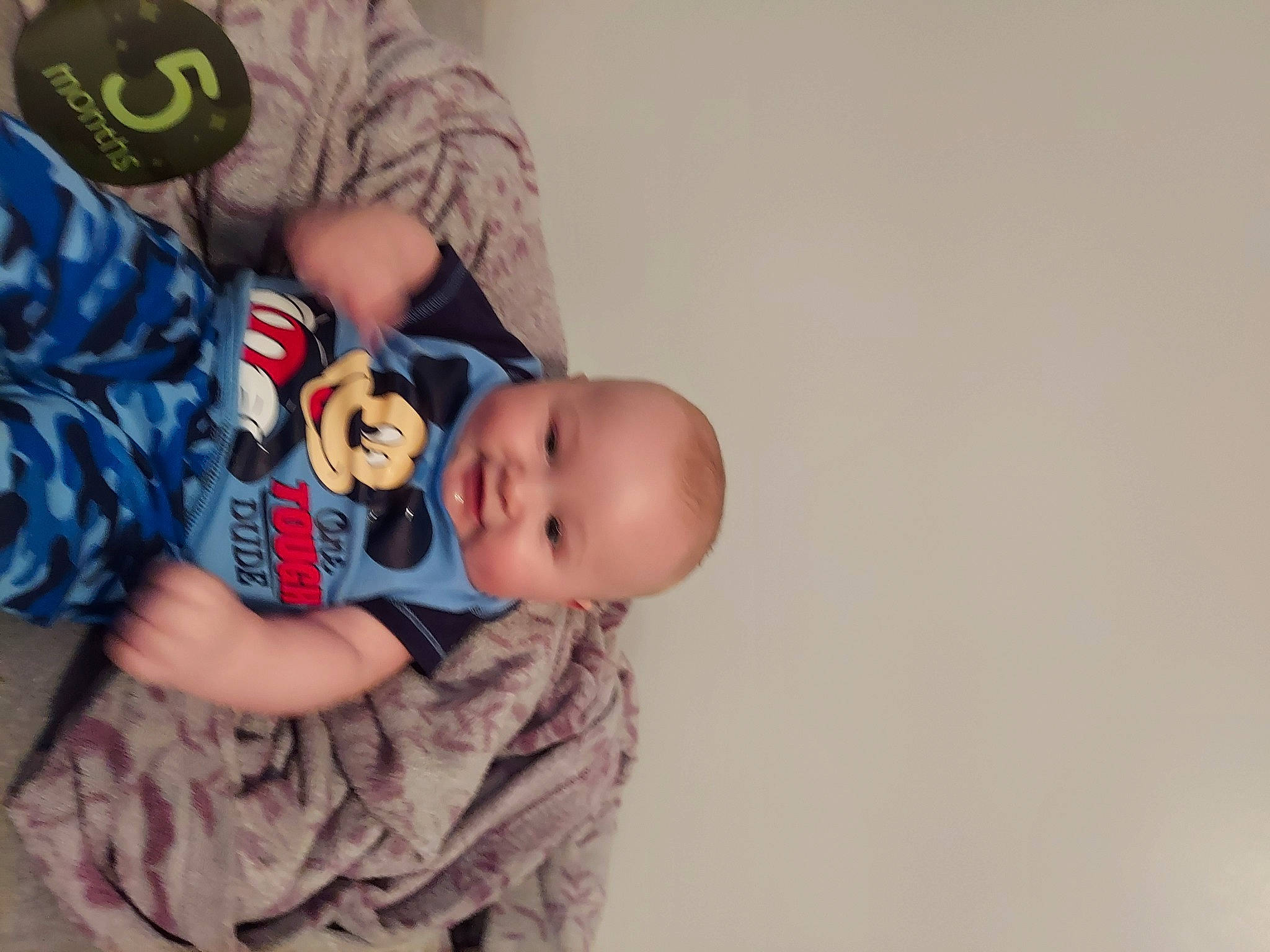 Jorden is registered to the contest to win money with this photo: baby, baby_products, baby_toddler_clothing, cheek, child, comfort, elbow, finger, fun, happy, headgear, mouth, pattern, person, sitting, sleeve, smile, t_shirt, toddler, trunk