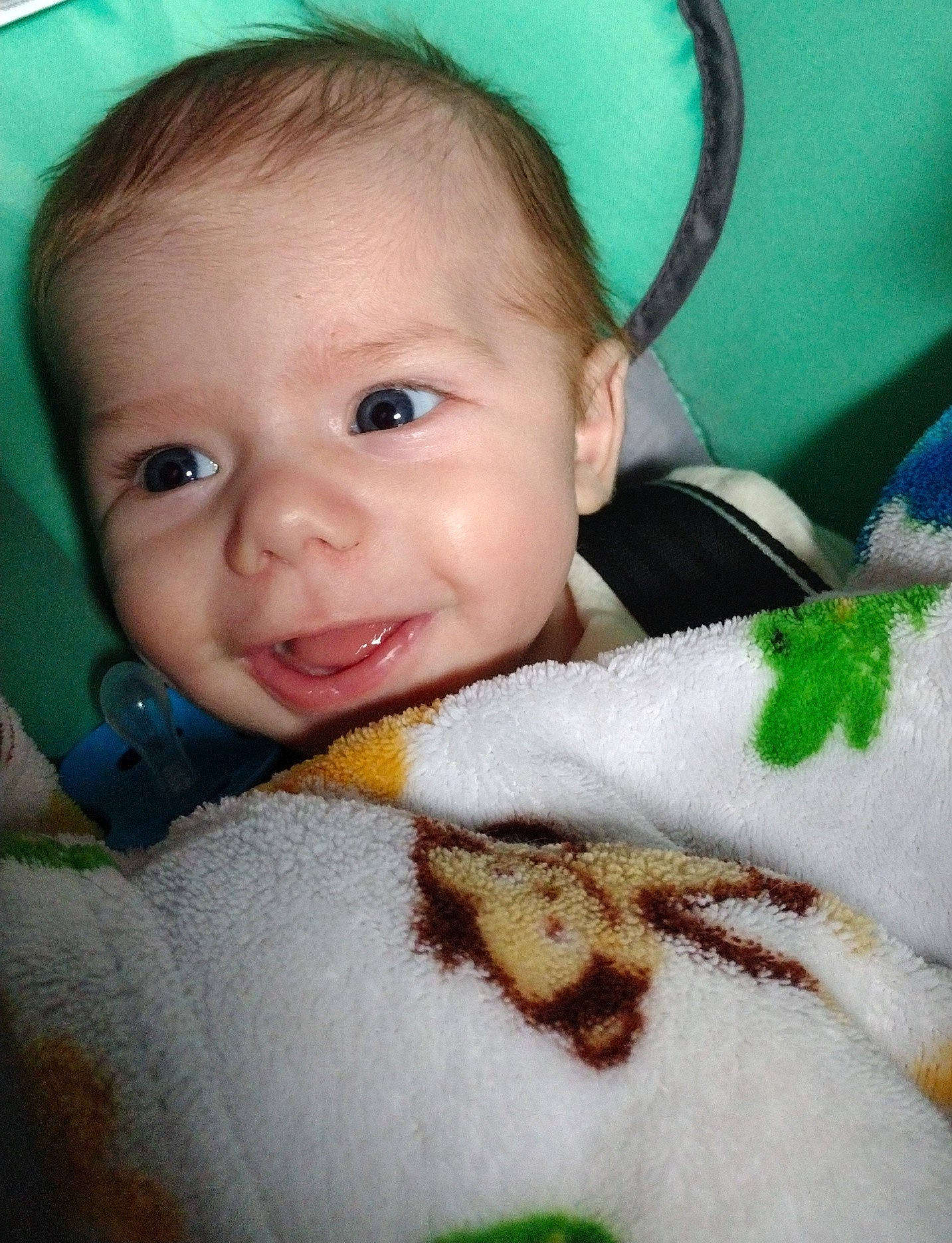 Bryson is registered to the contest to win money with this photo: baby, baby_toddler_clothing, brown_hair, cheek, child, close_up, eye, eyebrow, eyelash, face, fur, grass, happy, iris, lip, nose, person, skin, smile, textile