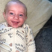 Hugo joined the competition — help win amazing prizes! baby, blanket, blue_eyes, child, close_up, clothing, cozy, cute, expression, face, happy, indoors, infant, lying_down, onesie, person, portrait, skin, smiling, soft_lighting