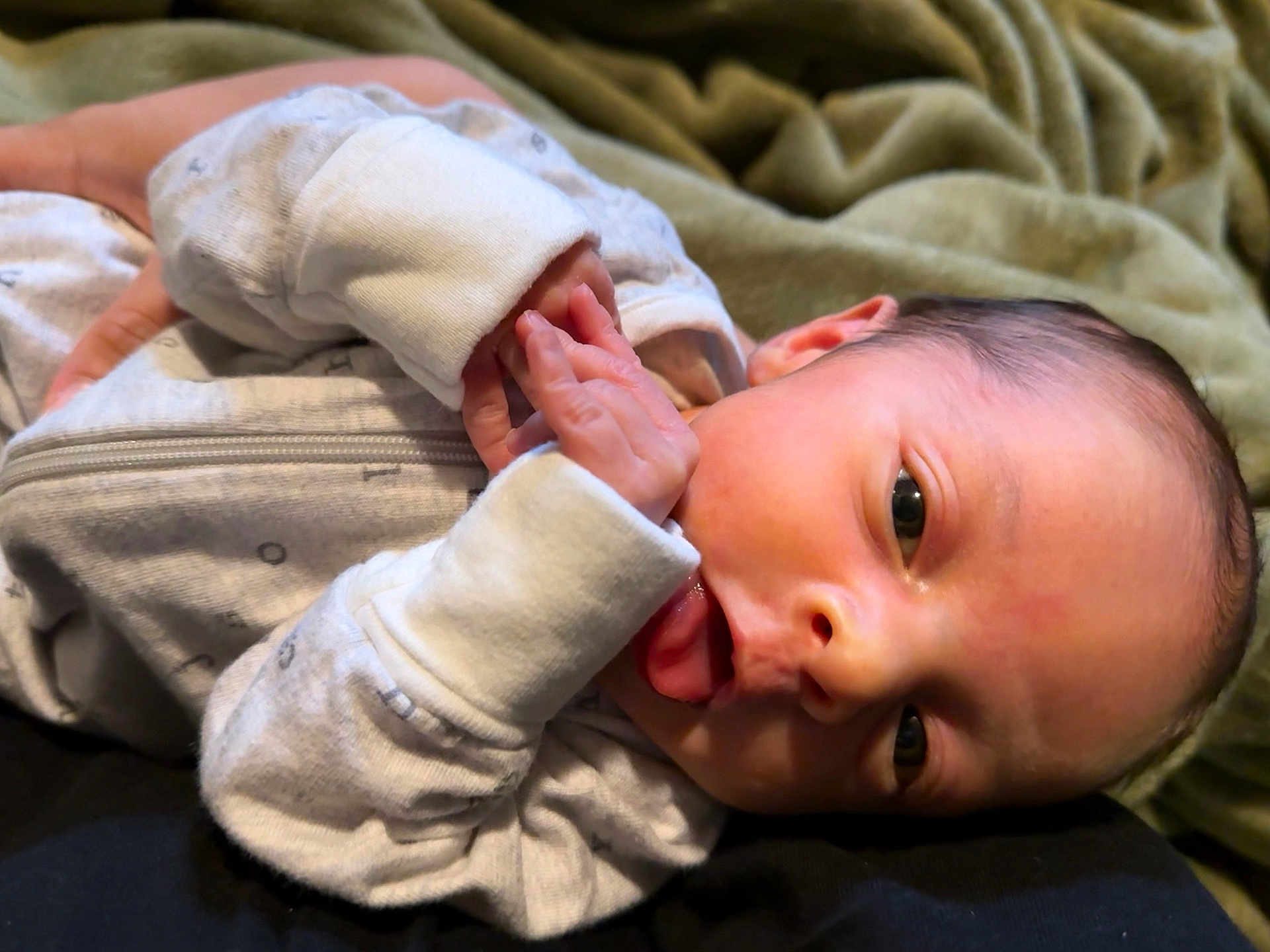 Jayden joined the competition — help win amazing prizes! baby, infant, newborn, face, hand, clothing, blanket, sleeping, cute, skin, person, portrait, newborn_clothes, lying_down, soft, small, child, human, indoors, resting