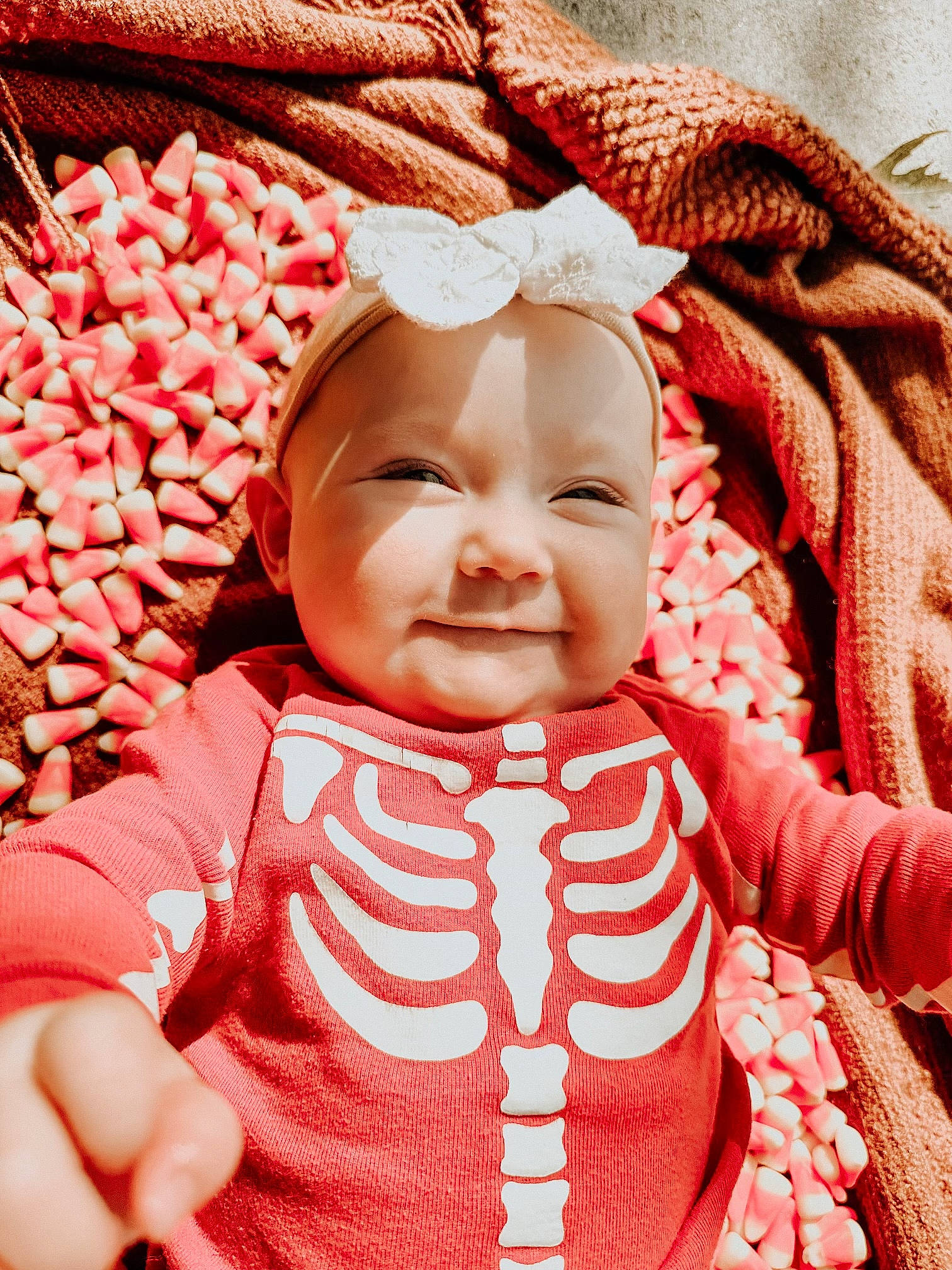 Aurie is registered to the contest to win money with this photo: baby, baby_sleeping, baby_toddler_clothing, carmine, cheek, child, fashion_accessory, happy, headwear, laugh, magenta, pattern, peach, people_in_nature, person, pink, red, skin, sleeve, smile