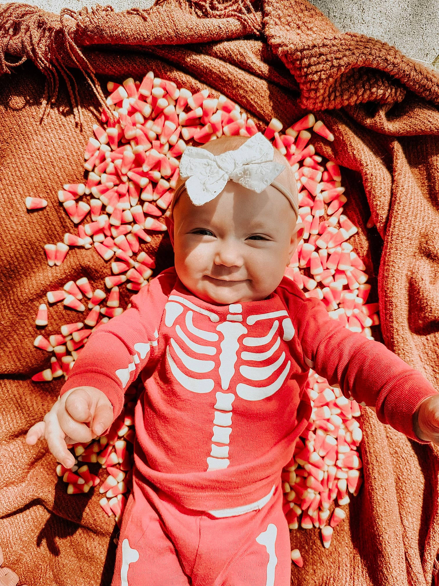Aurie is registered to the contest to win money with this photo: baby, baby_products, baby_sleeping, baby_toddler_clothing, fun, gesture, glasses, happy, head, headwear, human, magenta, pattern, peach, people_in_nature, person, pink, red, sleeve, smile