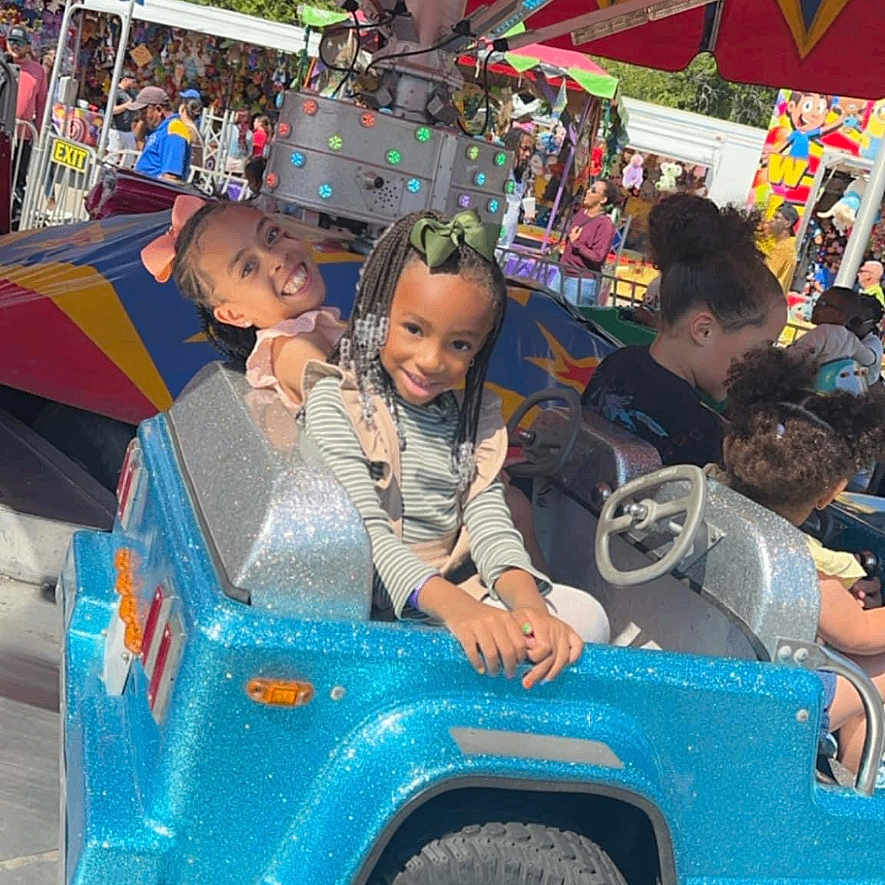 Ava is registered to the contest to win money with this photo: architecture, baby, boy, building, carnival, child, city, face, female, girl, head, machine, male, outdoors, person, photography, portrait, shelter, teen, wheel