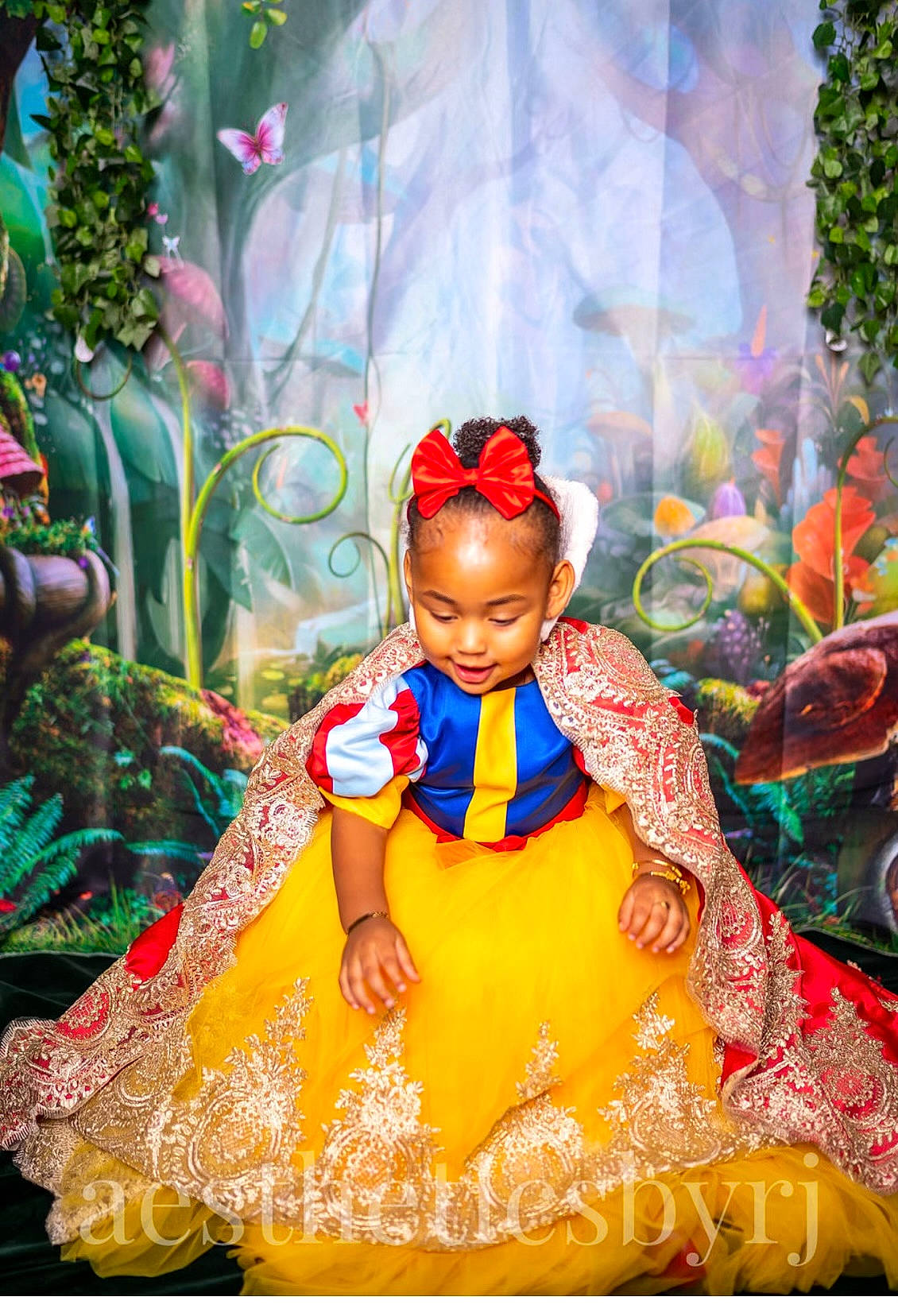 Rose is registered to the contest to win money with this photo: art, child, costume, doll, entertainment, event, fashion_design, formal_wear, fun, happy, headpiece, jewellery, magenta, peach, person, pink, plant, temple, toddler, toy