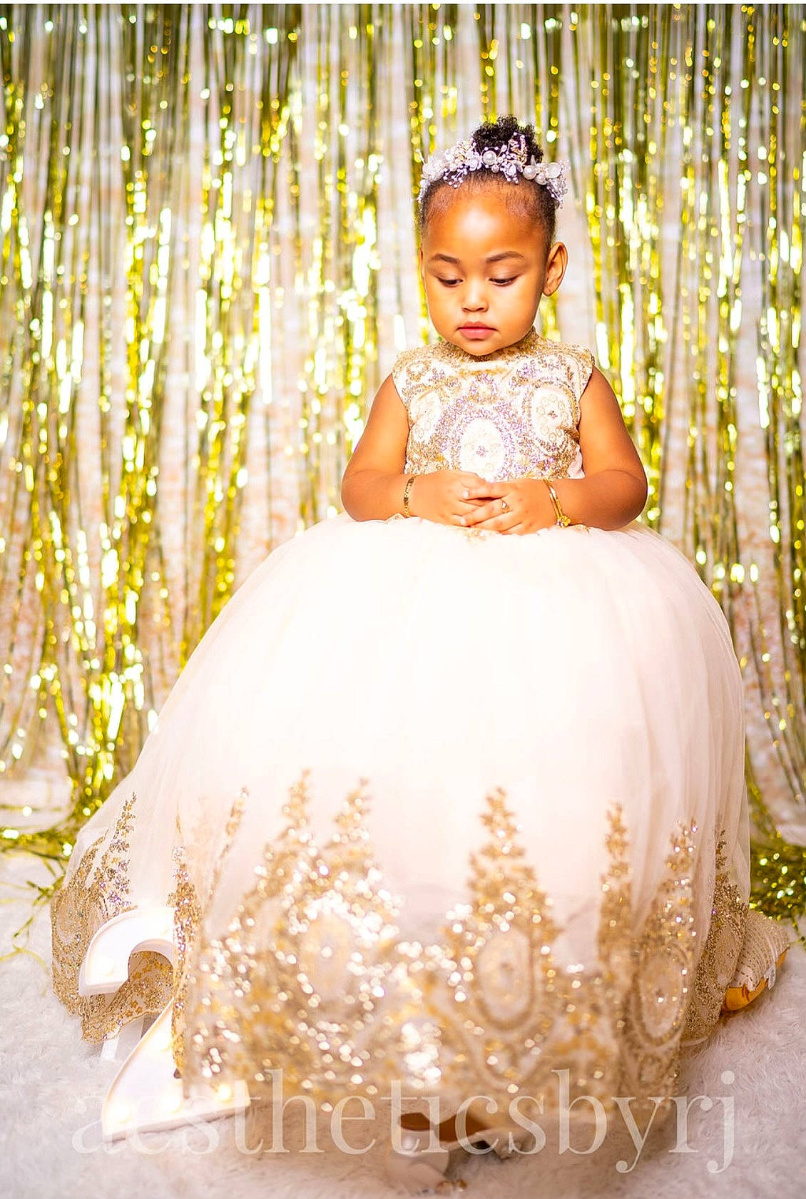 Rose is registered to the contest to win money with this photo: bridal_accessory, bridal_clothing, bridal_party_dress, child, clothing, dress, embellishment, fashion_design, flash_photography, formal_wear, gown, hairstyle, happy, head, headpiece, long_hair, person, textile, toddler, wedding_ceremony_supply