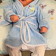 Rj joined the competition — help win amazing prizes! baby, infant, hood, bathrobe, blue, pillow, koala, blanket, booties, feet, hands, face, smile, expression, indoors, couch, soft_texture, belt, portrait, toddler_clothing