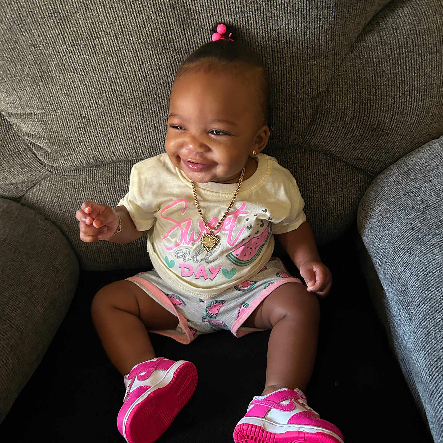 A Zhani joined the competition — help win amazing prizes! baby, child, clothing, couch, cute, fashion, footwear, girl, hair_accessory, happy, indoor, infant, jewelry, pink, portrait, shoes, sitting, smile, toddler, watermelon
