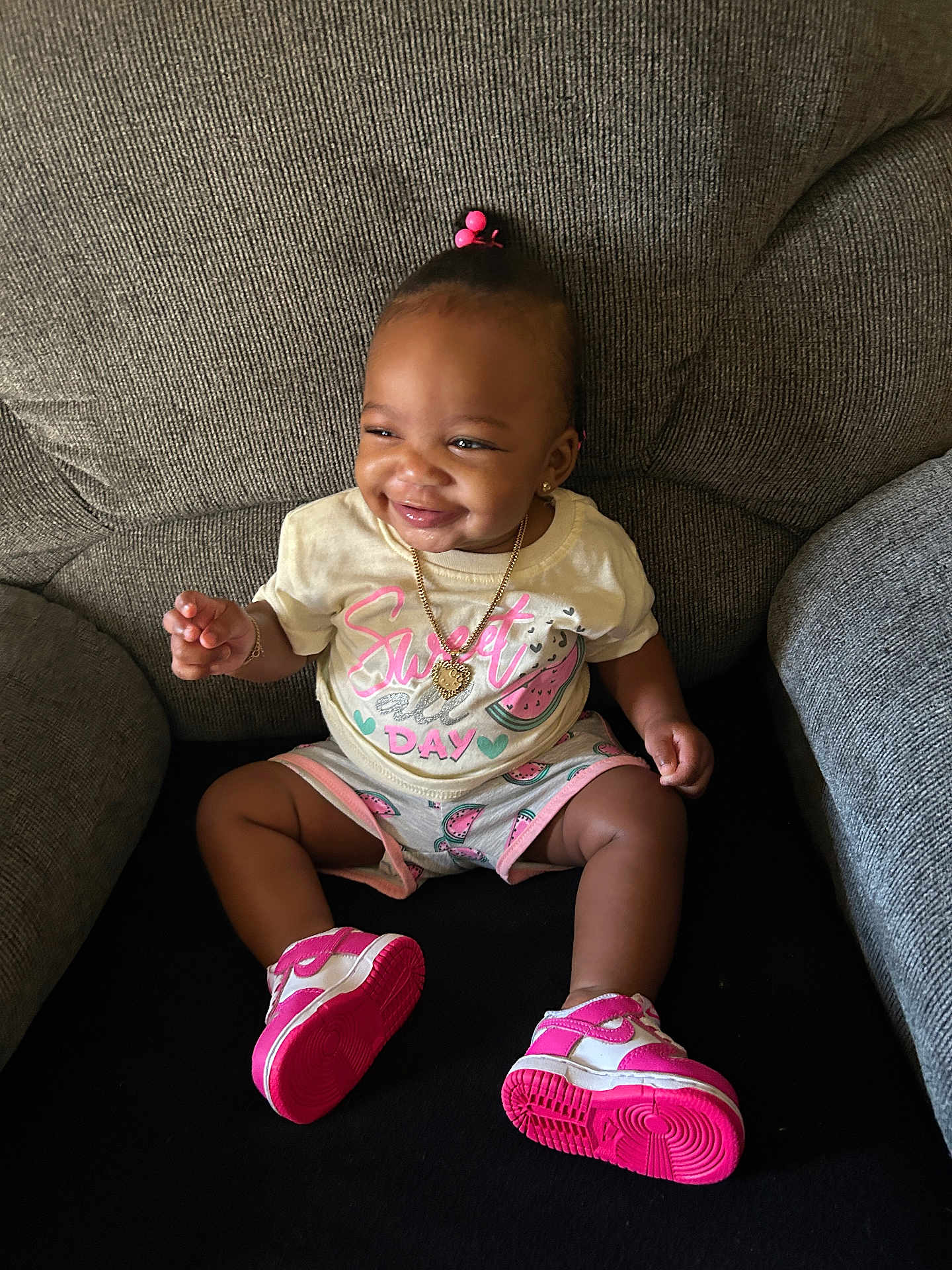 A Zhani joined the competition — help win amazing prizes! baby, girl, smile, sitting, couch, clothing, shoes, pink, watermelon, happy, jewelry, hair_accessory, infant, cute, portrait, indoor, child, footwear, toddler, fashion
