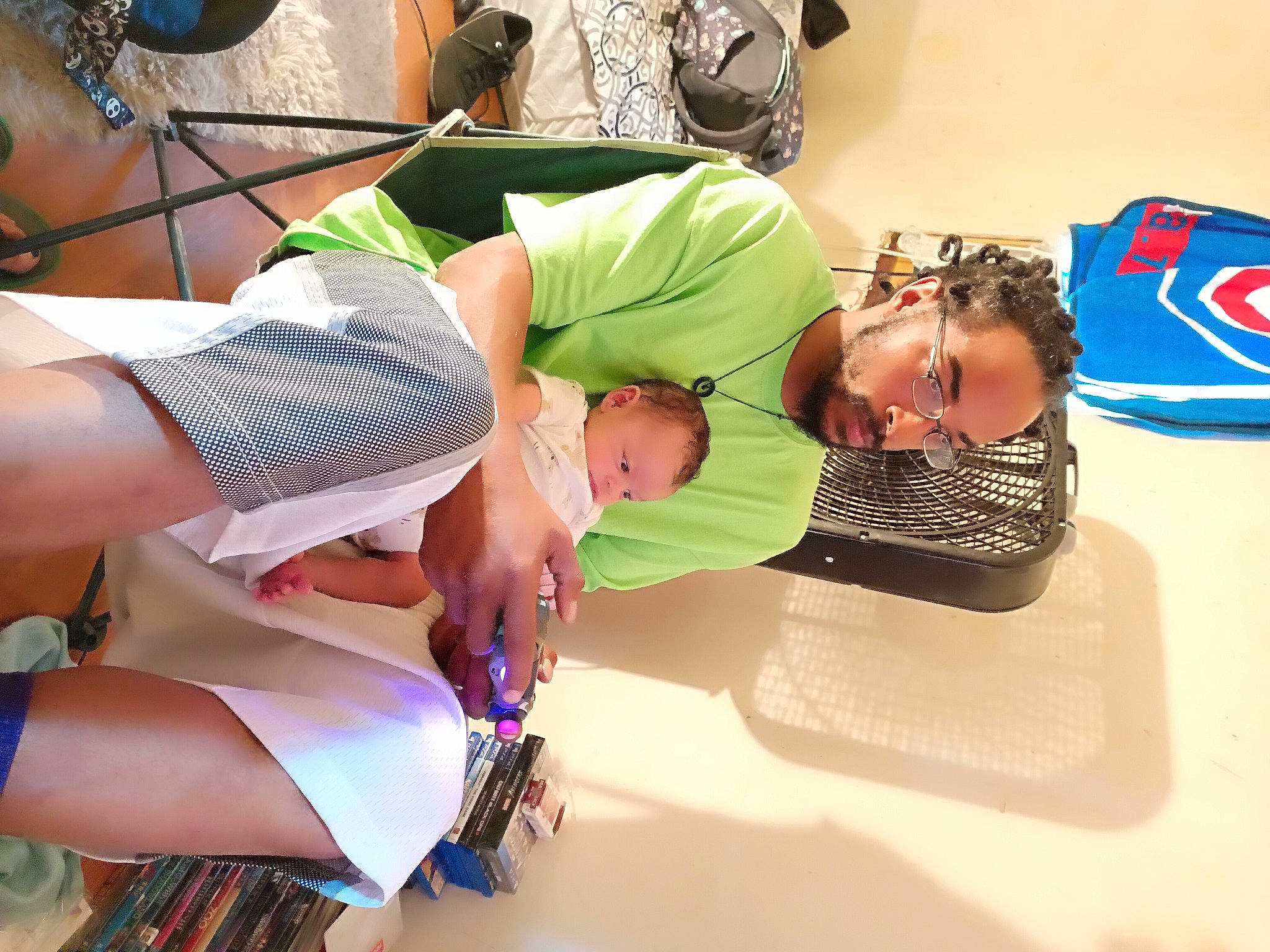 Lamar is registered to the contest to win money with this photo: abdomen, automotive_design, child, event, eyewear, fun, happy, hat, human_leg, knee, leisure, logo, pattern, person, room, shorts, sunglasses, t_shirt, thigh, toddler