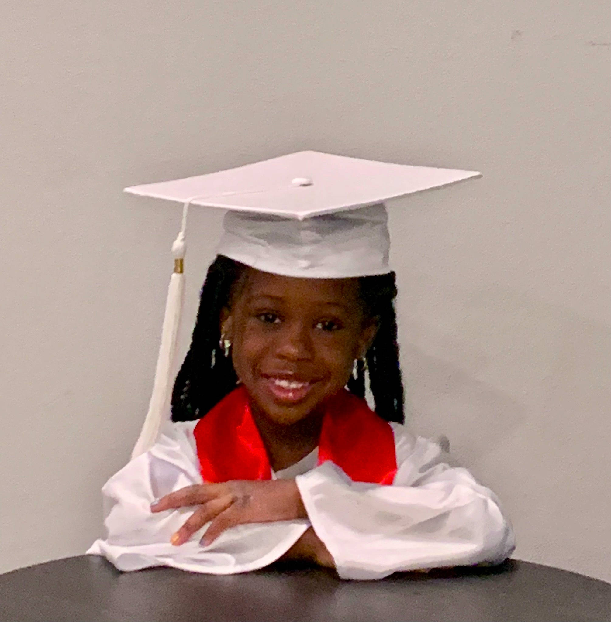 Dayah joined the competition — help win amazing prizes! academic_certificate, academic_dress, academic_institution, event, fashion_accessory, formal_wear, fun, gesture, graduation, happy, joy, mortarboard, person, phd, public_event, room, scholar, sleeve, smile, table