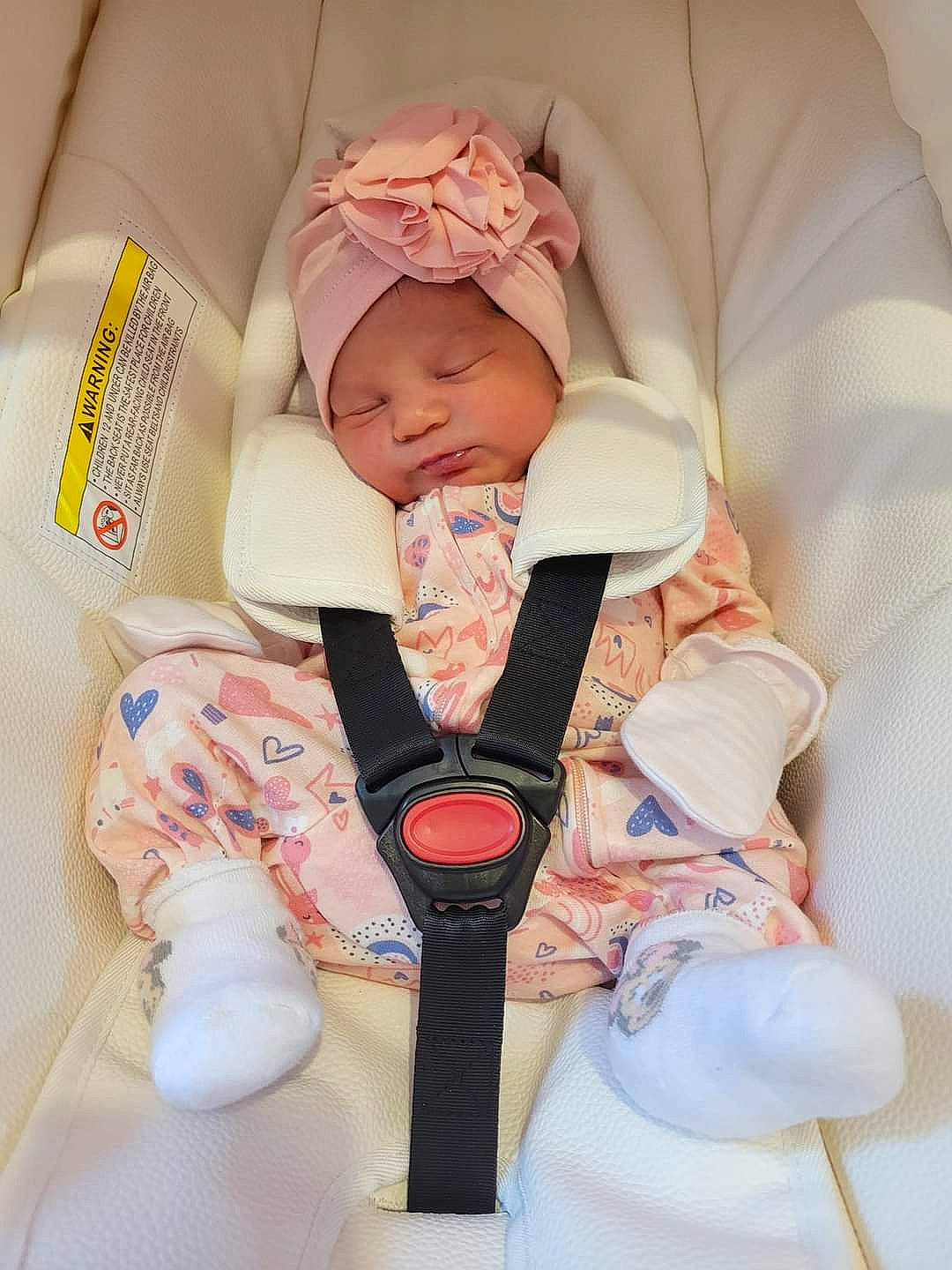 Emily is registered to the contest to win money with this photo: baby, baby_products, baby_safety, baby_sleeping, baby_toddler_clothing, cheek, child, collar, comfort, face, headwear, human_body, linens, peach, person, service, skin, sleeve, textile, thumb