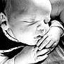 baby, sleeping, close_up, black_and_white, infant, hands, peaceful, face, newborn, soft_lighting, portrait, cute, resting, calm, skin, child, toddler, monochrome, cozy, serene