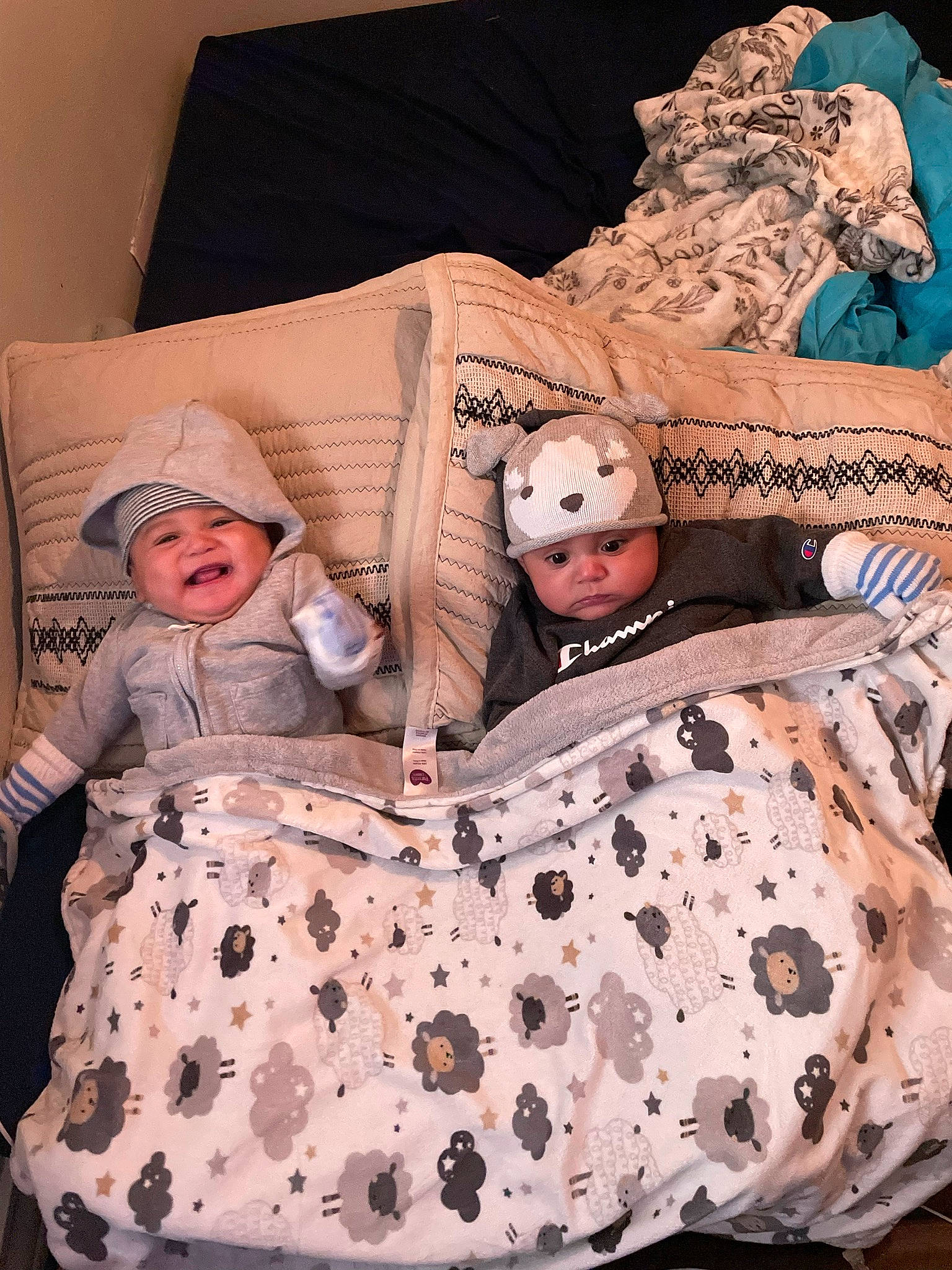 Ezekiel is registered to the contest to win money with this photo: baby_toddler_clothing, bedding, cheek, child, comfort, doll, eye, fashion_design, hairstyle, head, headgear, headwear, linens, one_piece_garment, pattern, person, pink, sleeve, textile, toy