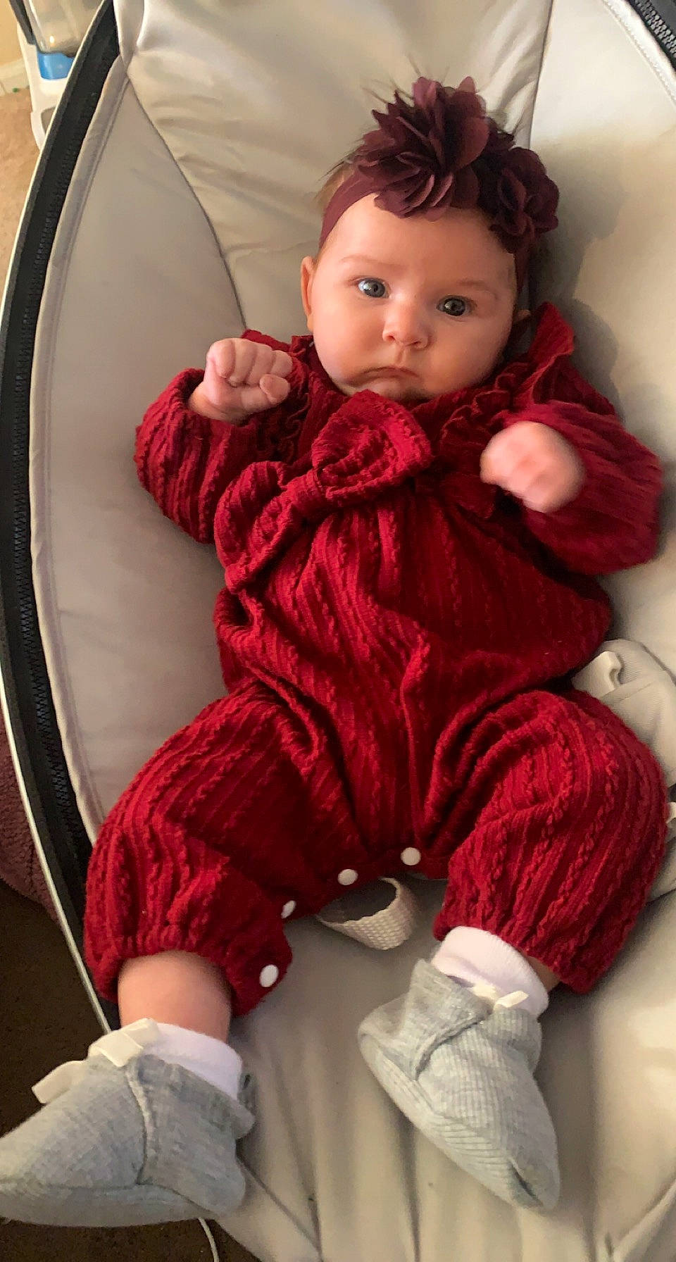 Caylee is registered to the contest to win money with this photo: baby, baby_toddler_clothing, cheek, child, comfort, eye, face, flooring, lip, magenta, pattern, person, pink, red, sitting, skin, sleeve, sock, toddler, white