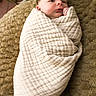 newborn, baby, wrapped, blanket, soft_texture, beige, cozy, infant, portrait, cute, face, lying_down, indoors, warm, resting, child, sleepy, peaceful, small, bundle