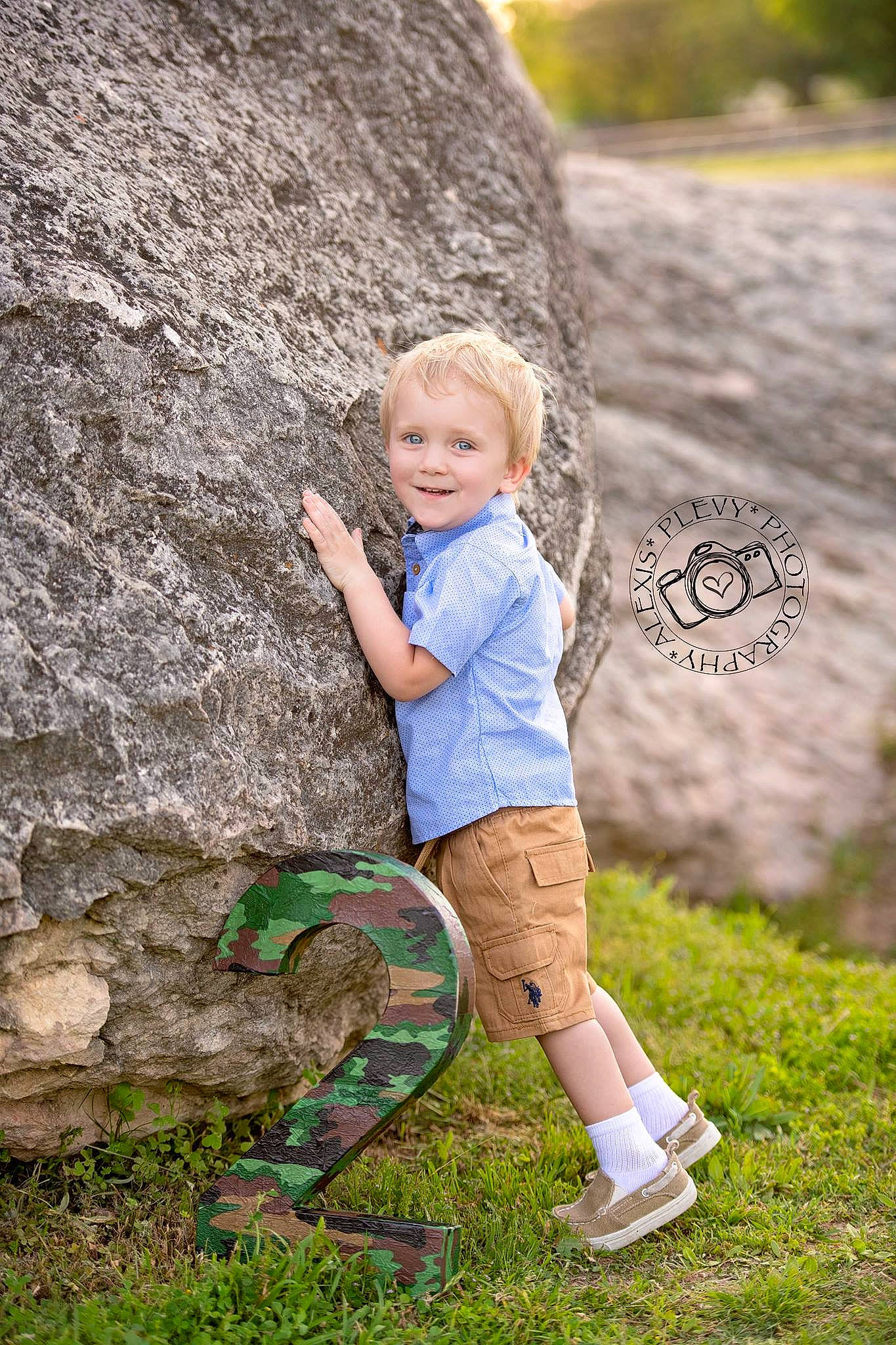 Kody is registered to the contest to win money with this photo: blond, child, child_model, fun, grass, joy, person, photograph, photography, plant, play, portrait_photography, rock, smile, toddler, tree, vacation